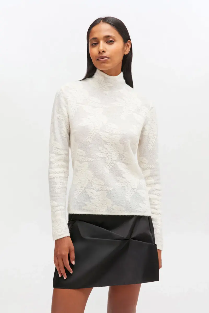 Ivory genomskinlig turtleneck