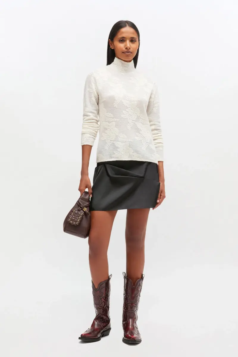 Ivory genomskinlig turtleneck