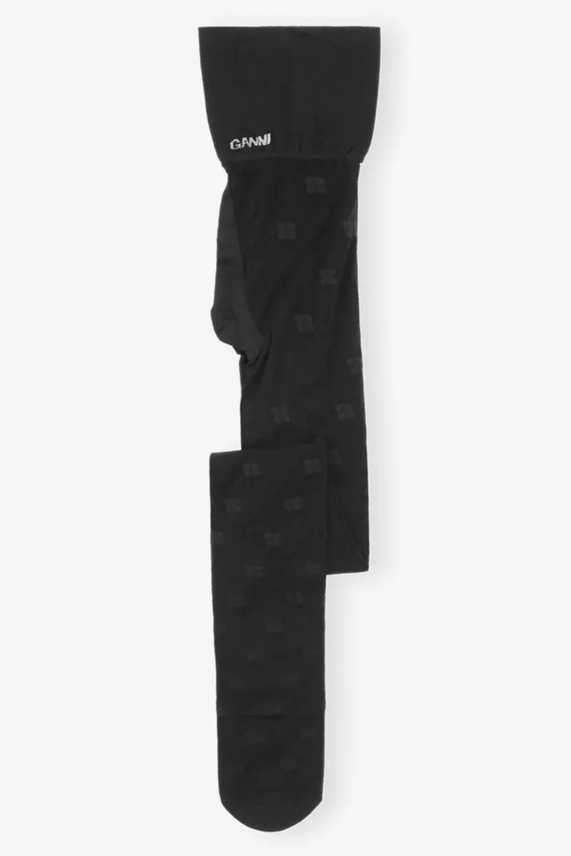 Svarta tights med fjärilsmönster